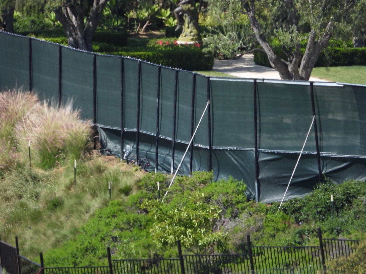 Beverly Hills, CA  - *EXCLUSIVE*  - A black screen is completed across Tyler Perry’s  million Beverly Hills mansion, now reportedly the home of Prince Harry, his wife Meghan Markle and their baby son, Archie. The screen, pictured here from public hiking trails, now almost spans the entire rear of the mansion. A hiker there on Tuesday (May 12), a local mom, 44, of an 11-year-old boy, said: “The screen looks ugly. It’s out of character with the area. I can’t believe they were allowed to put it up.  It’s surrounded by homes worth millions and no-other property has anything like it, it looks cheap and nasty.  There are A-list celebrities who live nearby, they must be appalled at how this looks.”  A half-naked man was also seen taking selfies on a trail that leads up a hill to the perimeter of the house on Tuesday afternoon.

BACKGRID USA 12 MAY 2020,Image: 518941859, License: Rights-managed, Restrictions: , Model Release: no, Credit line: BACKGRID / Backgrid USA / Profimedia